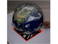 Deomnstration of Fraunhofer's Augmented Reality system showing a virtual Earth globe on a marker. The system tracks the movement of the marker. Deomnstration of Fraunhofer's Augmented Reality system showing a virtual Earth globe on a marker. The system tracks the movement of the marker.